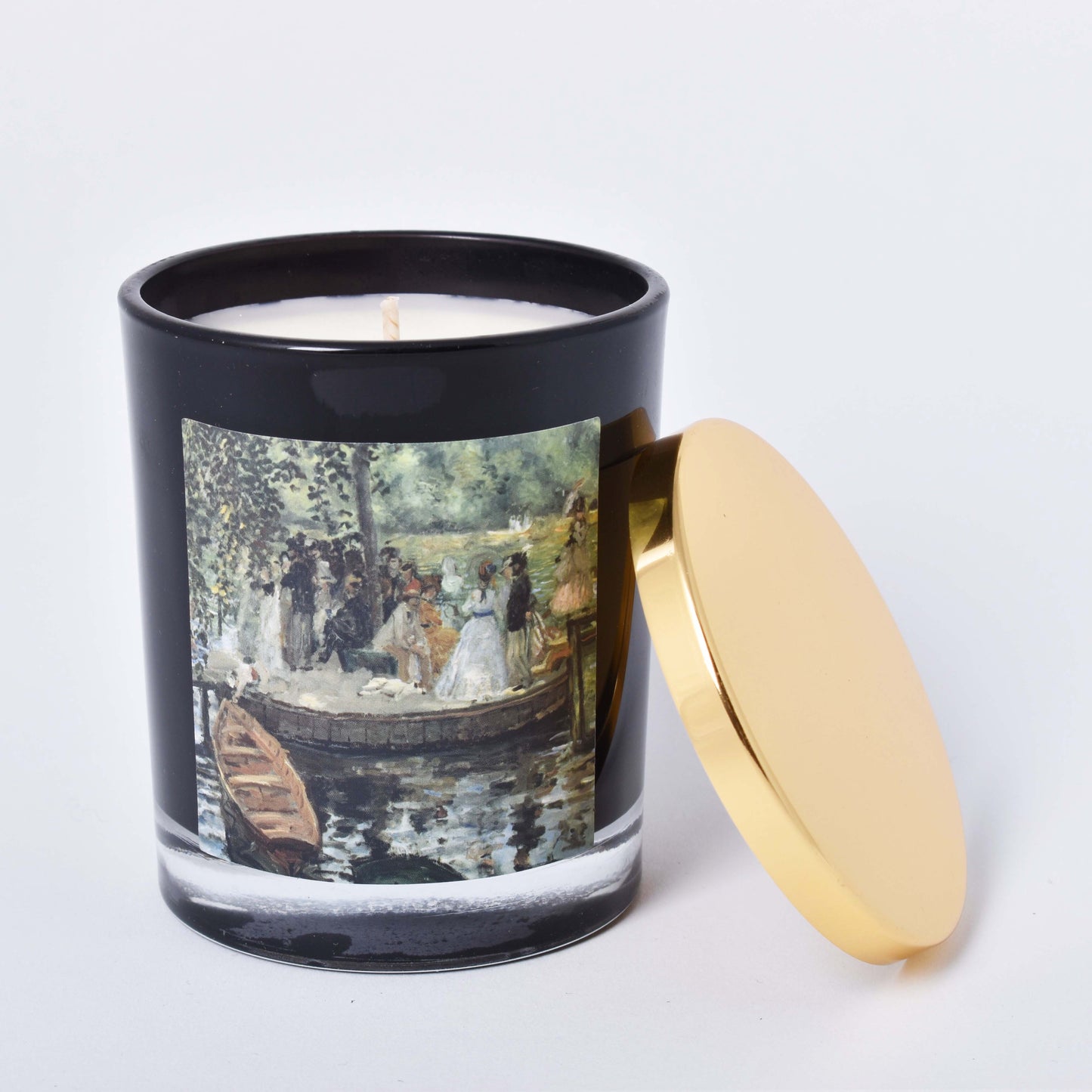 Doftljus med motiv av Auguste Renoirs La Grenouillère och lock av mässing