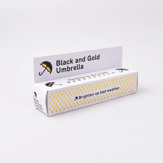 förpackning till paraply i svart och guld