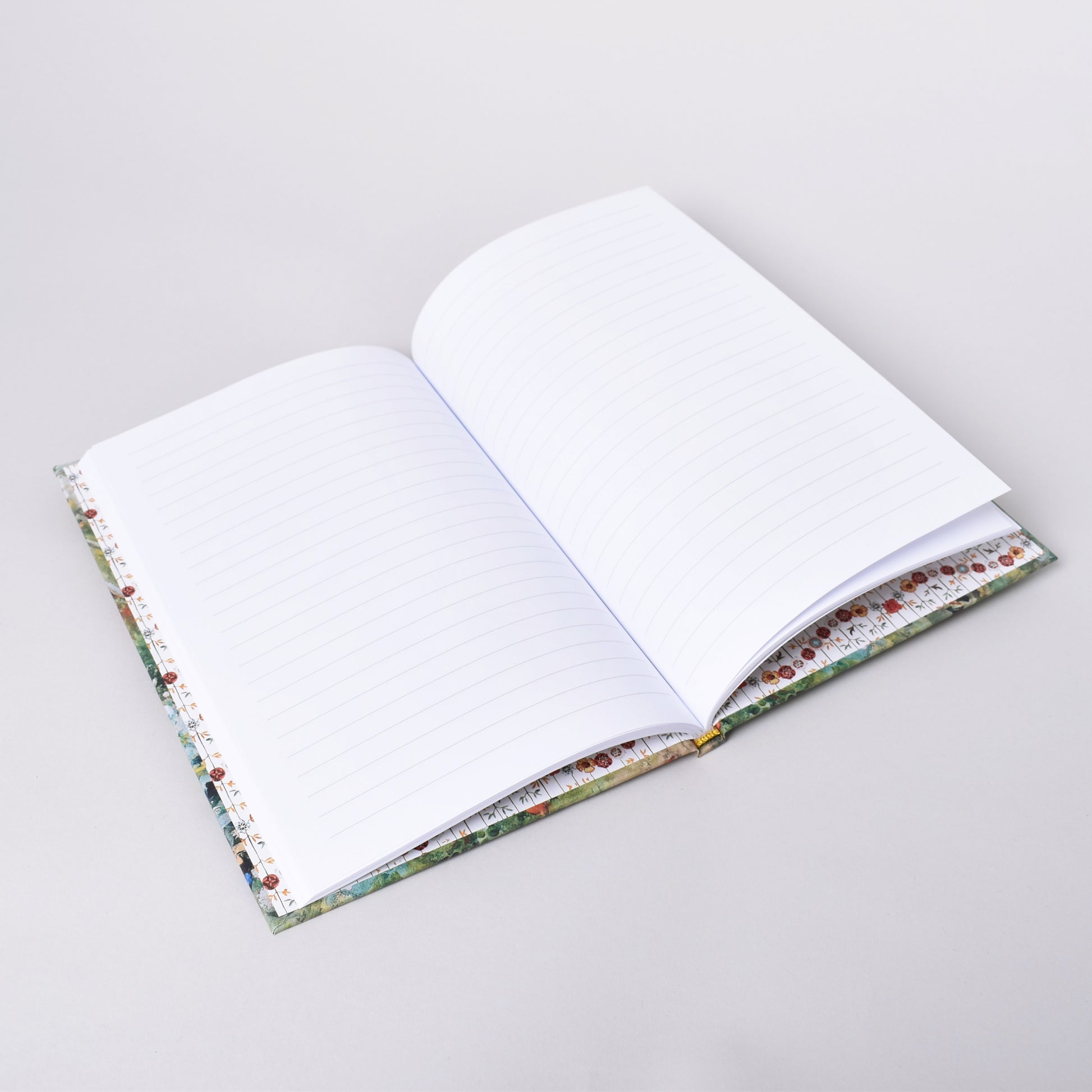 Linjerade sidor i anteckningshäfte med Carl Larsson motiv