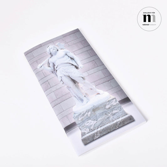 Långsmal anteckningshäfte med omslagsmotiv av Bengt Erland Fogelbergs skulptur Tor från Nationalmuseum