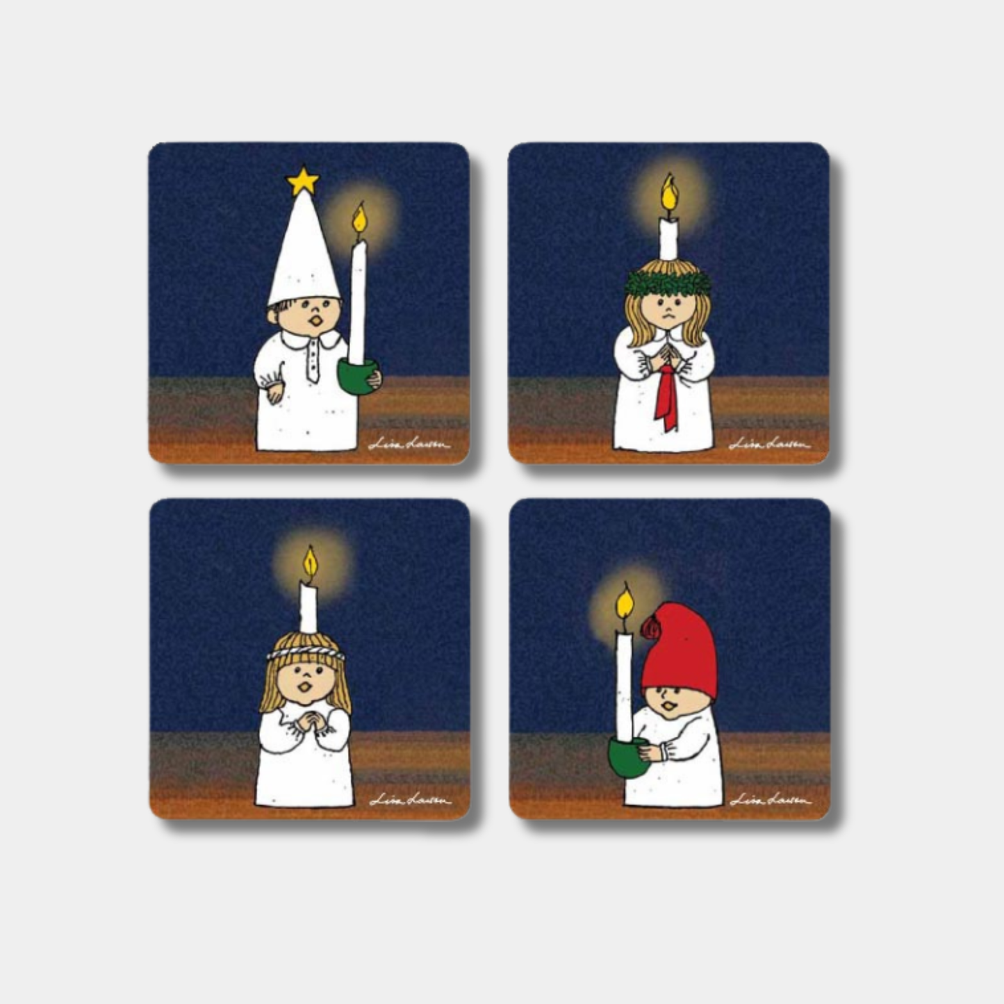 fyra glasunderlägg med motiv av luciatåg av Lisa Larson