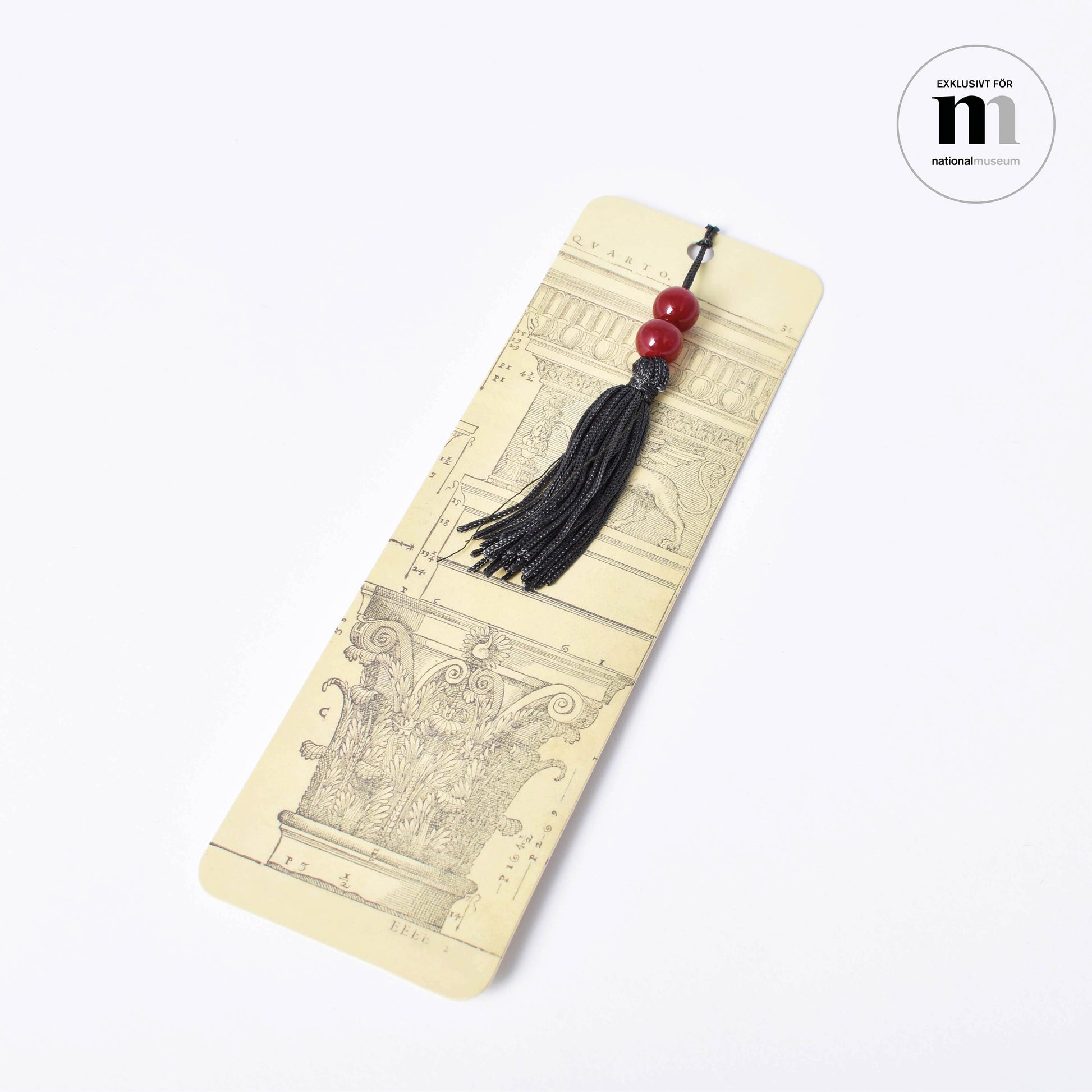 Vackert bokmärke med arkitekturritningar och svart tofs från Nationalmuseum