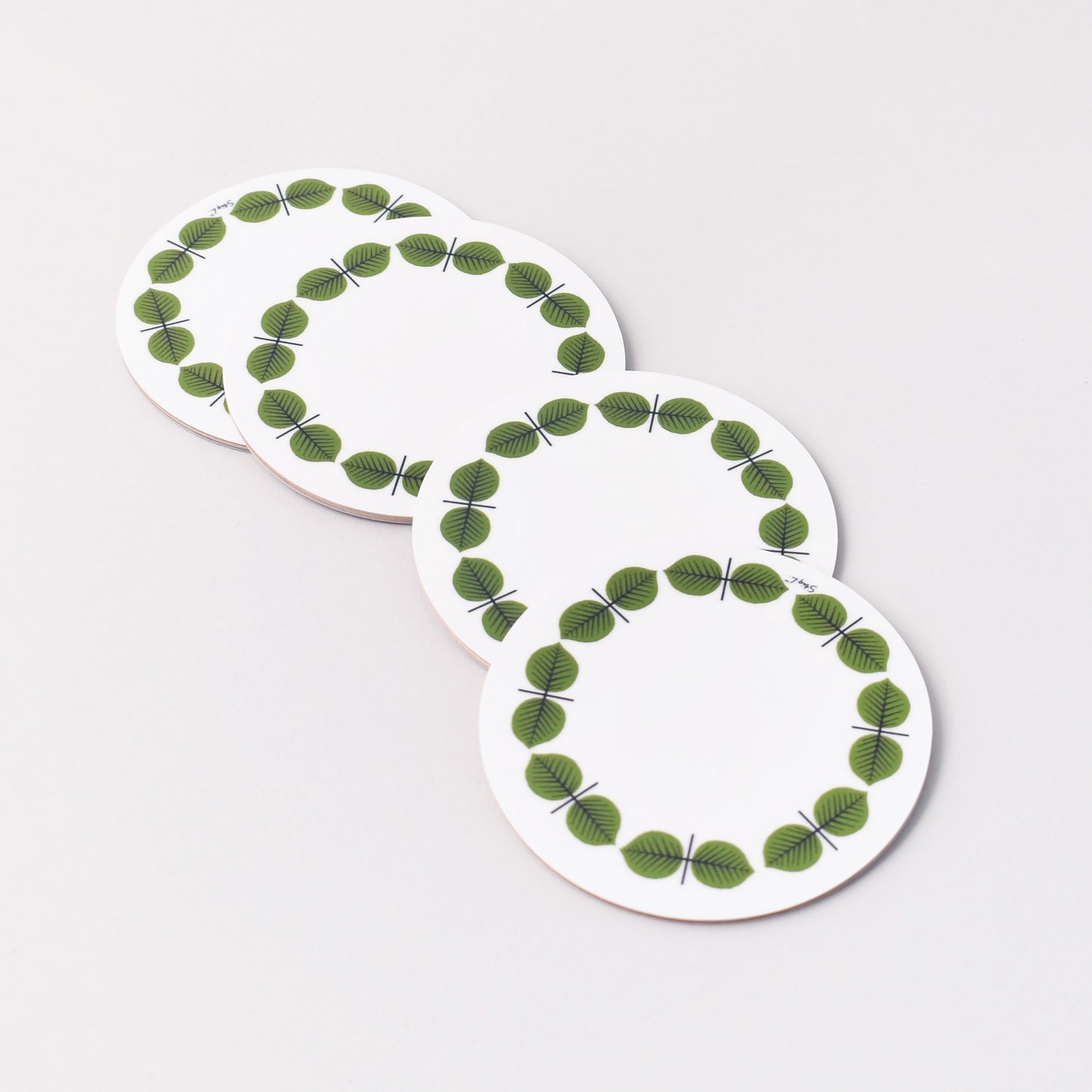 fyra glasunderlägg med Stig Lindbergs mönster Berså