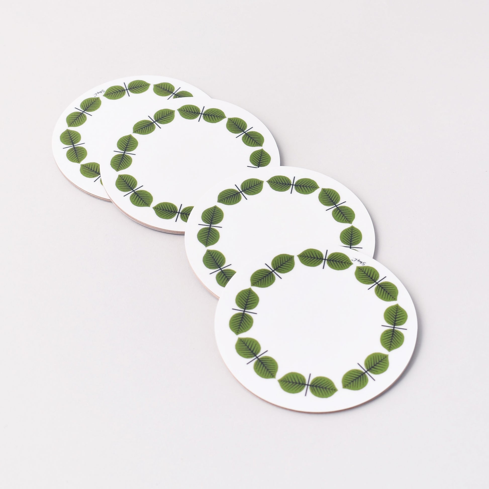 fyra glasunderlägg med Stig Lindbergs mönster Berså