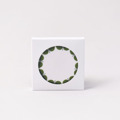 coasters med Stig Lindbergs Berså i vit förpackning