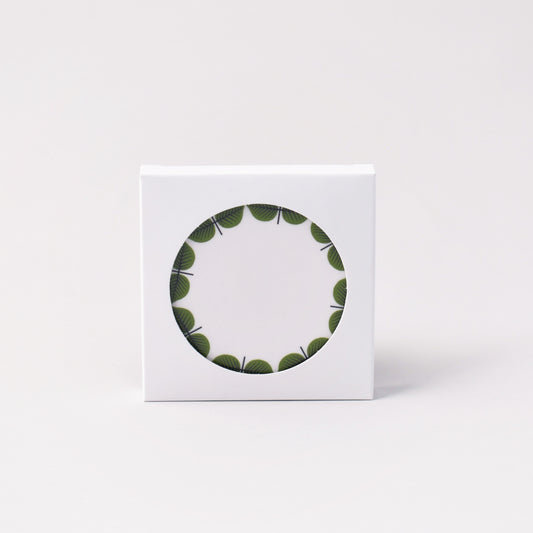 coasters med Stig Lindbergs Berså i vit förpackning