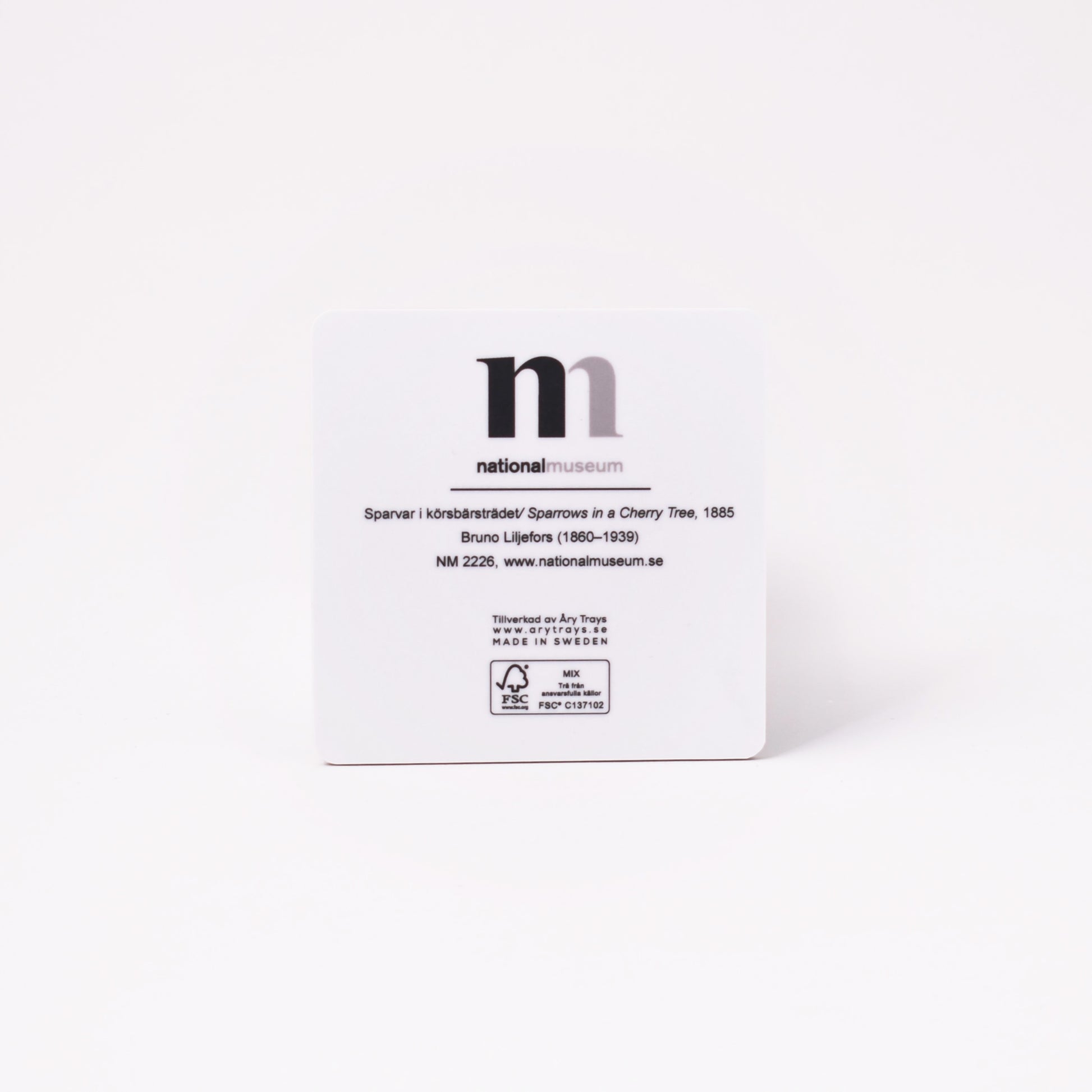 vit baksida av coaster med målning av bruno liljefors