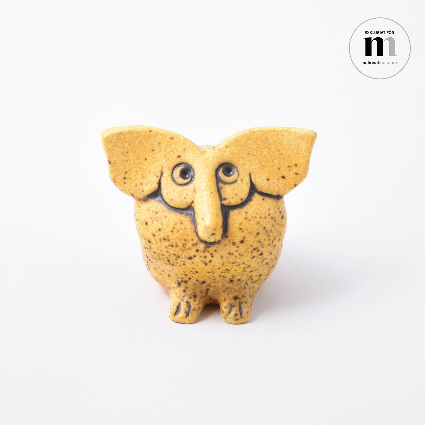 Djur med stora öron och lång näsa i gult av Lisa Larson med namnet Olga