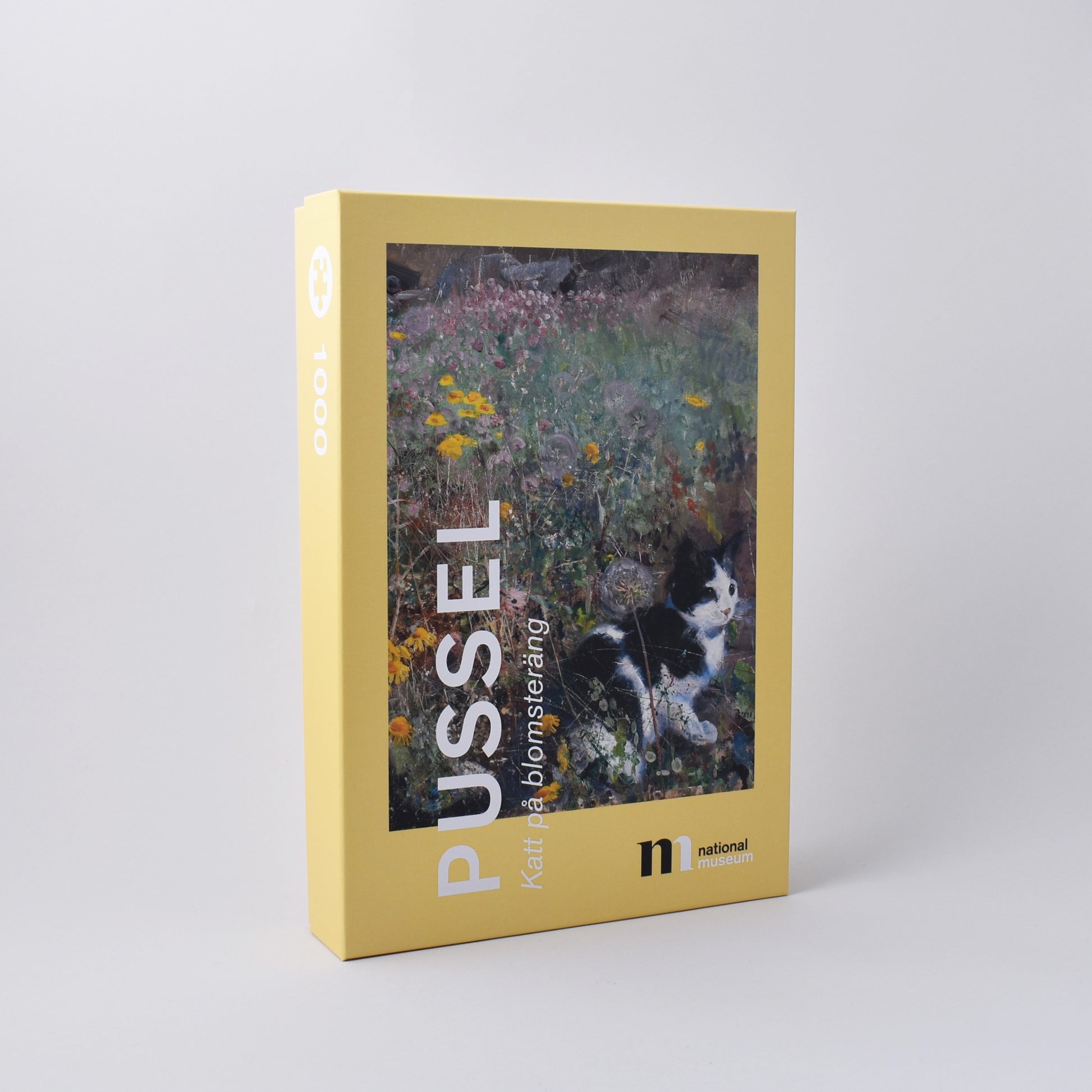 vackert pussel i gul ask med Bruno Liljefors målning Katt på blomsteräng från Nationalmuseum