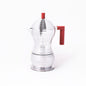 Espressobryggare från Alessi i aluminium med röda handtag