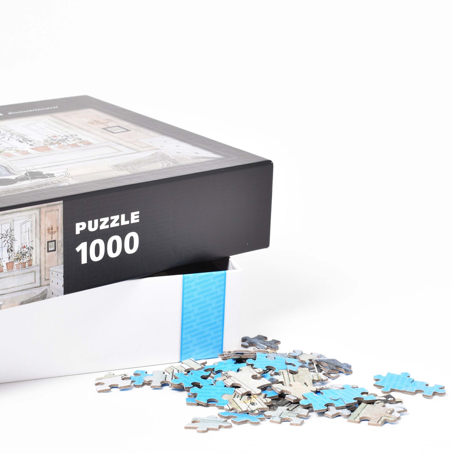 Närbild på förpackningen till Carl Larsson pussel