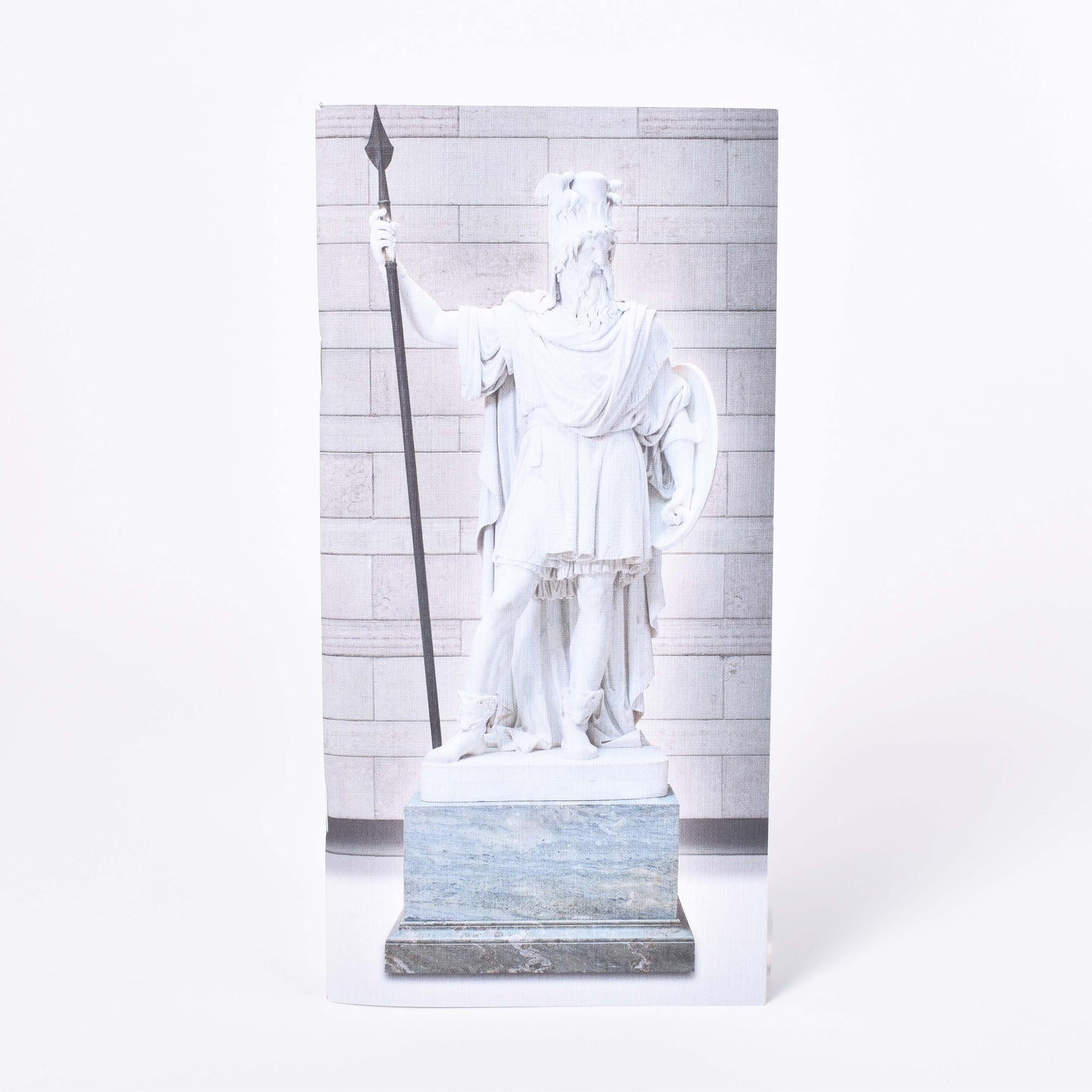 Långsmal anteckningshäfte med omslagsmotiv av Bengt Erland Fogelbergs skulptur Oden