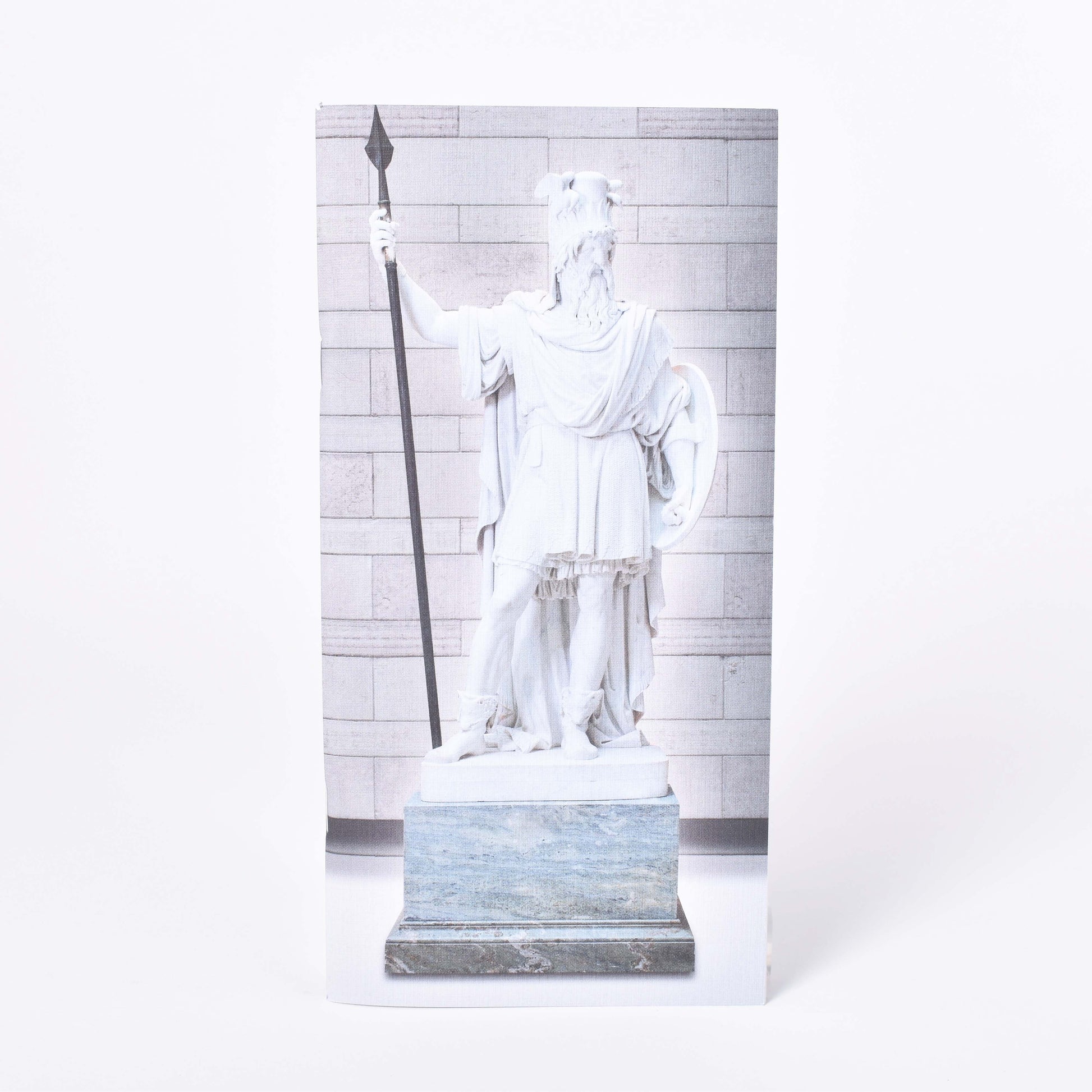 Långsmal anteckningshäfte med omslagsmotiv av Bengt Erland Fogelbergs skulptur Oden