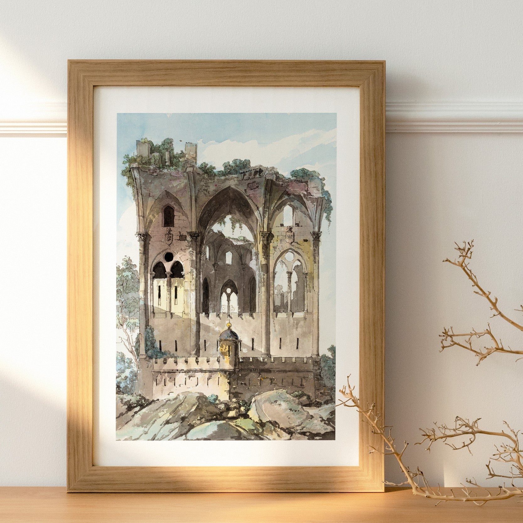 Affisch i träram med motiv av en borgruin från utställningen trädgården på Nationalmuseum