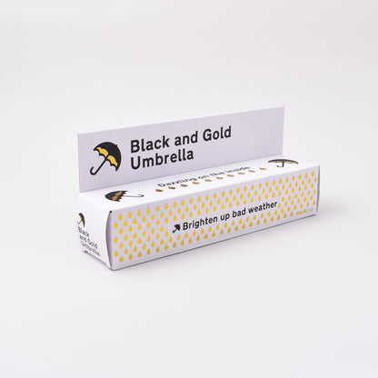 förpackning till paraply i svart och guld