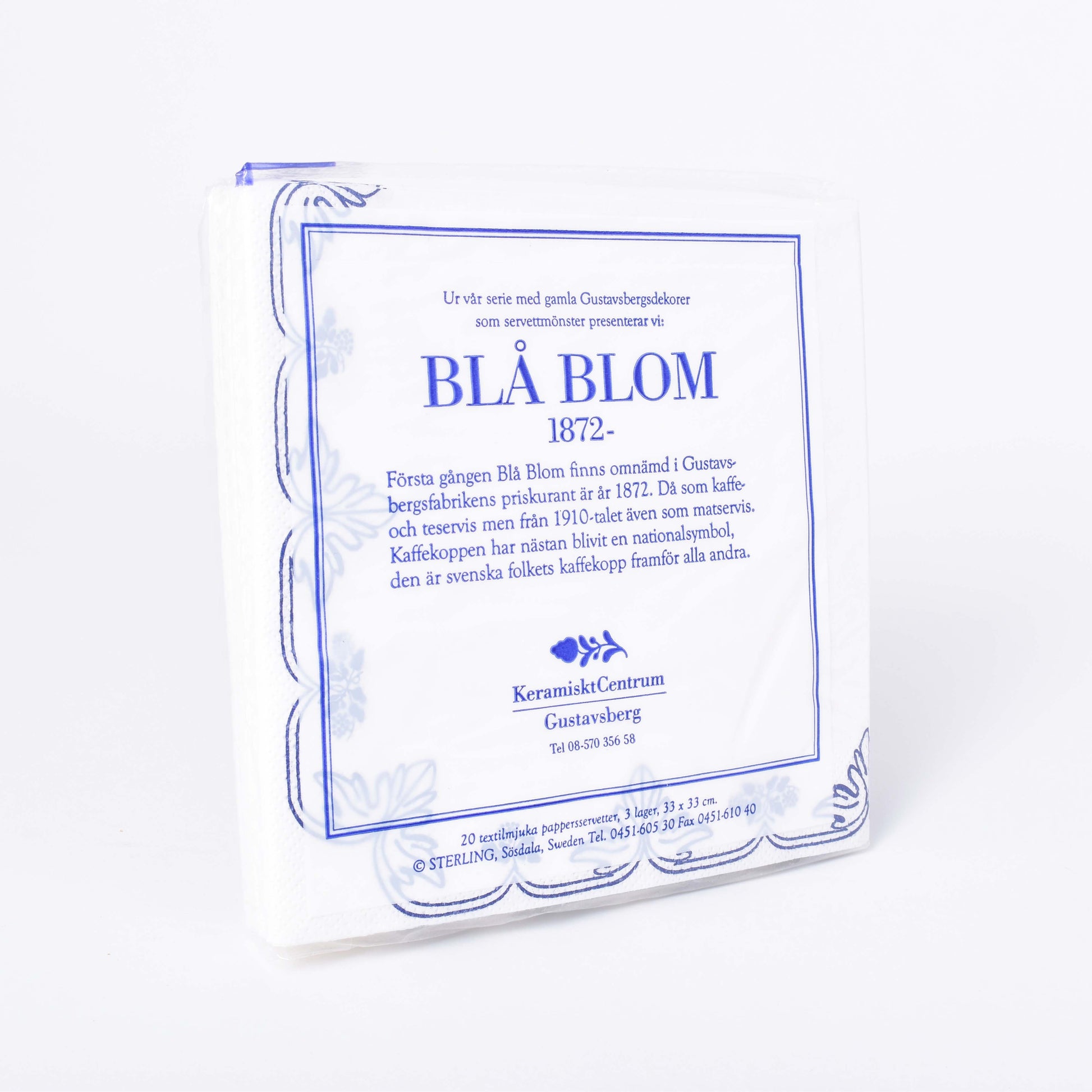 Servetter med mönster av blå druvklasar mot vit botten