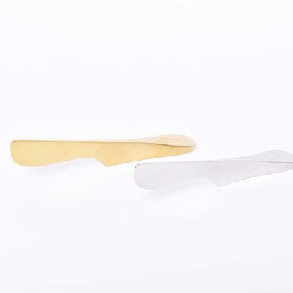 smörkniv i mässing och silver